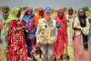 Photo of the Executive Director of WFP and IASC Champion on PSEAH, Ms. Cindy McCain with a group of women